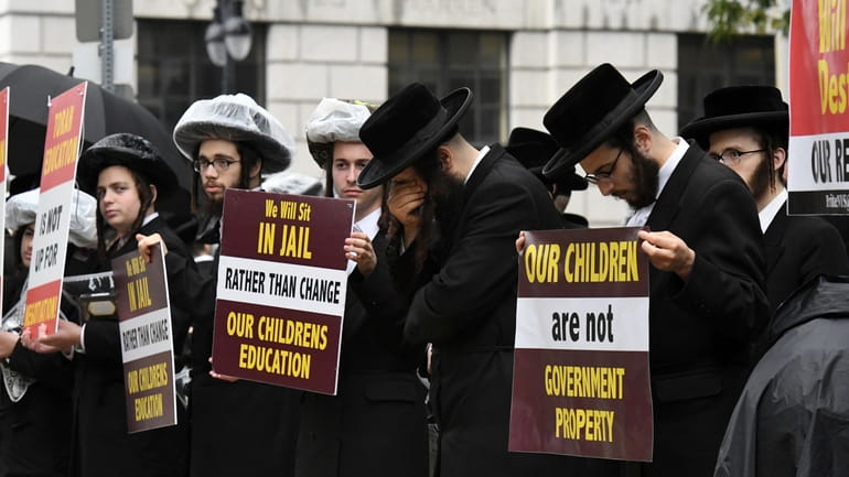 Members of the ultra-Orthodox and Hasidic Jewish communities protest in Albany...