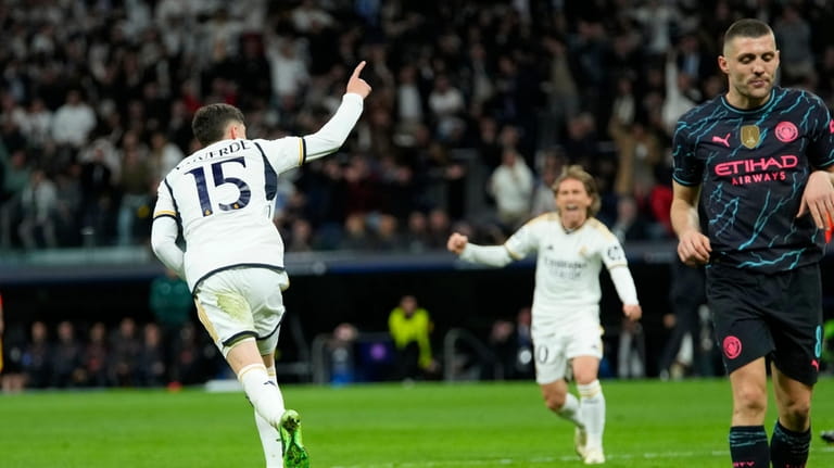 Real Madrid's Federico Valverde celebrates scoring his side's third goal...