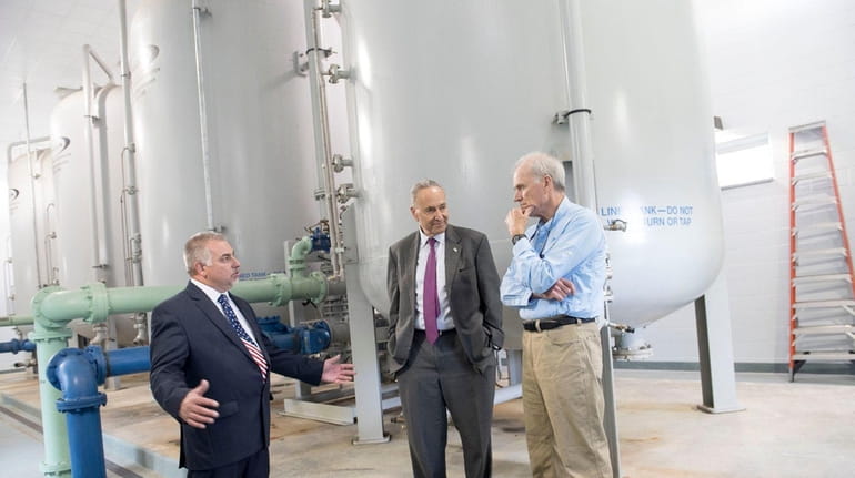 Bethpage Water District Superintendent Mike Boufis (left) giving a tour...