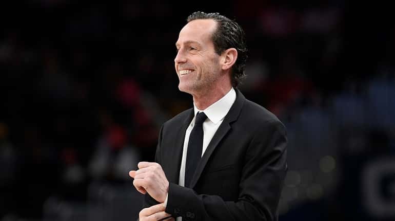  Kenny Atkinson watches during the first half between the Nets...