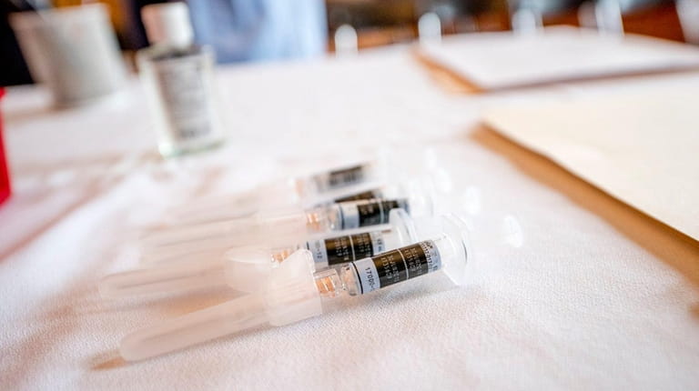 Flu shots are prepared during a free flu-shot drive by...