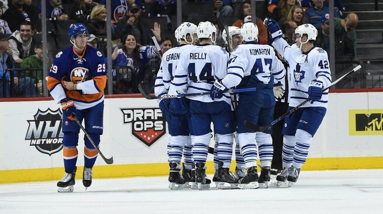 The Toronto Maple Leafs celebrate a goal by Toronto Maple...