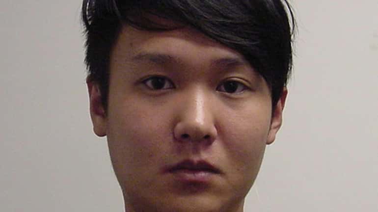 Bing Jie Yang, 23, of Westbury, is accused of beating...