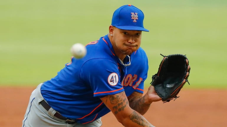 Taijuan Walker #99 of the Mets pitches in the second inning...