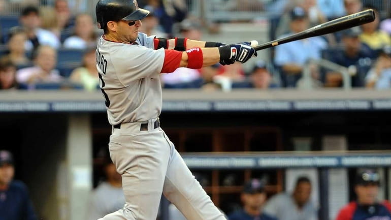 Boston Red Sox' Marco Scutaro hits an RBI single in...