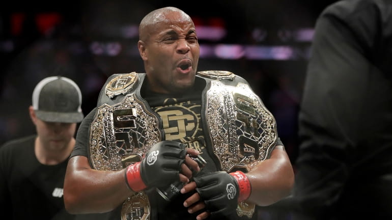 FILE - Daniel Cormier reacts after defeating Derrick Lewis by...