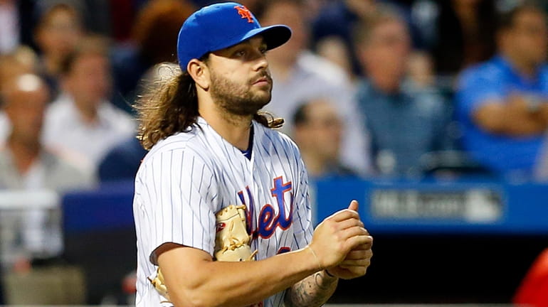 Robert Gsellman of the New York Mets looks on after...
