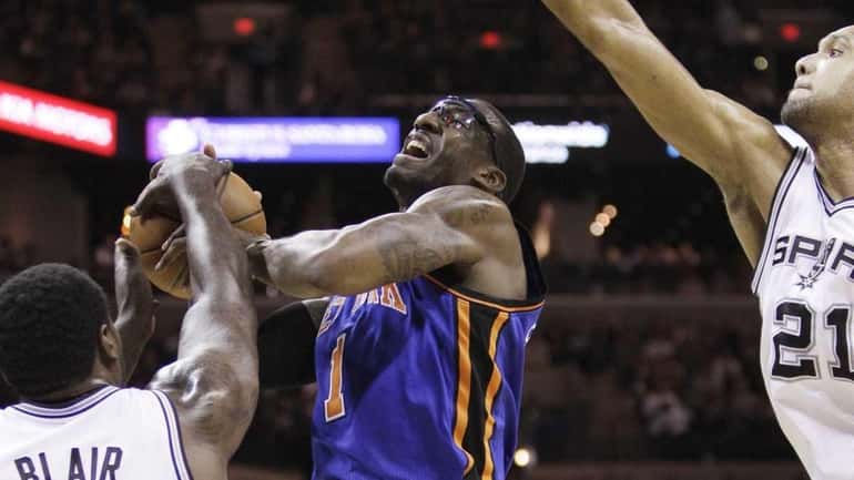 New York Knicks' Amare Stoudemire (1) is defended by San...