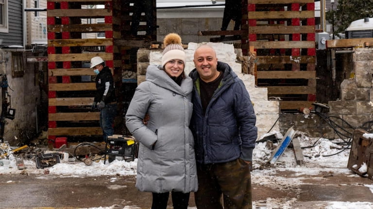 Architect Carolina Bassal and her husband, Arash Merabi, in front of a...