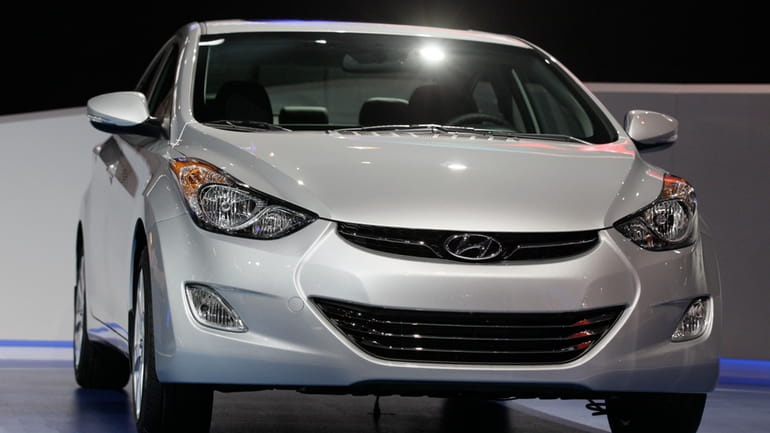 A 2013 Hyundai Elantra Coupe is shown at the Chicago...