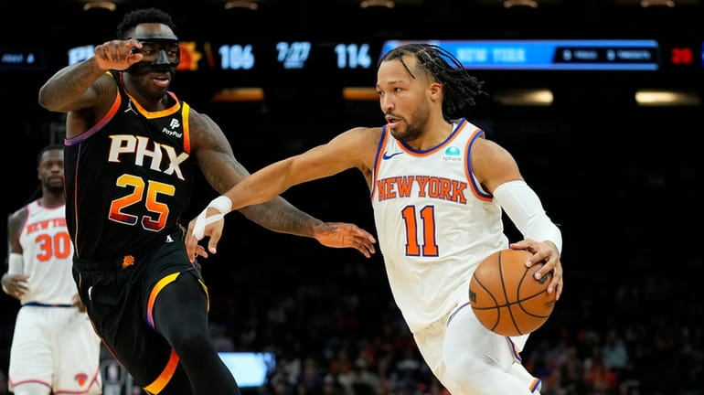 Knicks guard Jalen Brunson (11) drives as Phoenix Suns forward...