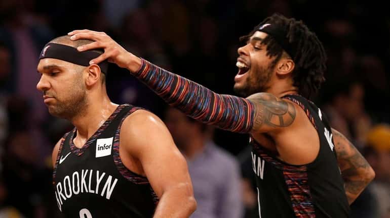 Jared Dudley #6 of the Nets celebrates a basket late...