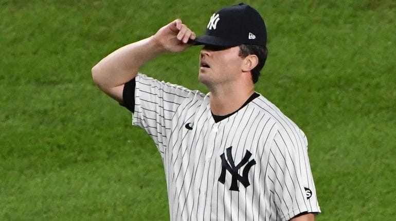 Yankees relief pitcher Zack Britton reacts after the Tampa Bay...