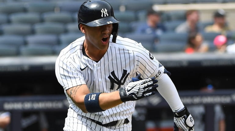 Yankees shortstop Gleyber Torres reacts as he runs on his...