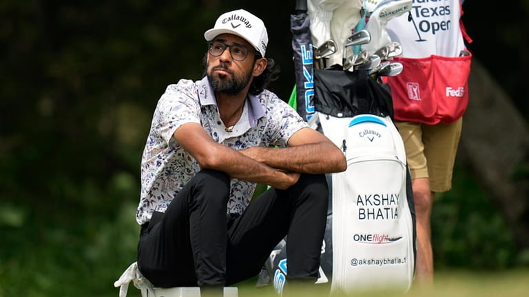 Akshay Bhatia waits to hit his tee shot on the...