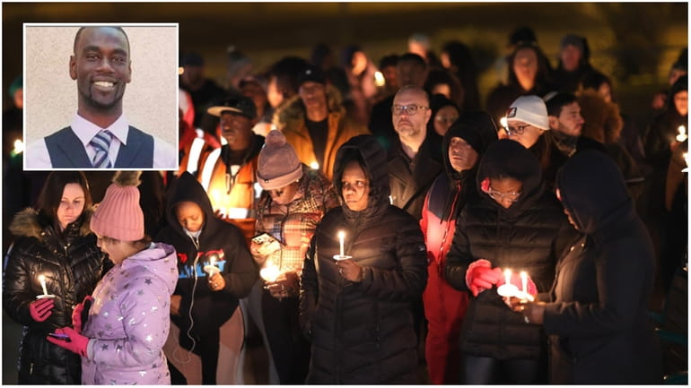 People attend a candlelight vigil in memory of Tyre Nichols Thursday in...