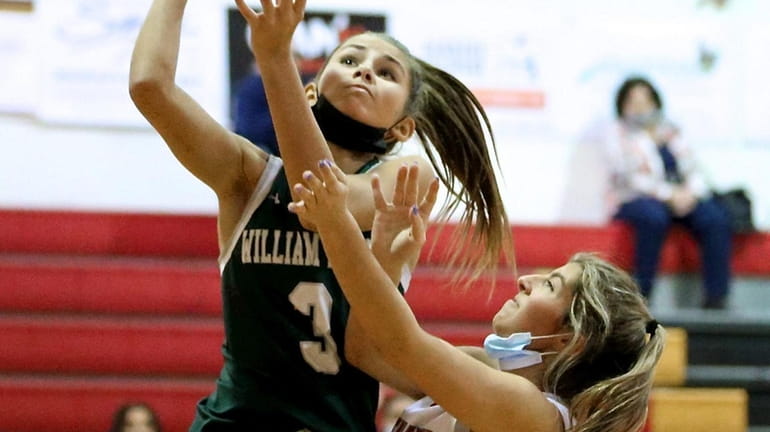 William Floyd guard Jacky Sutherland hits the baseline layup for...