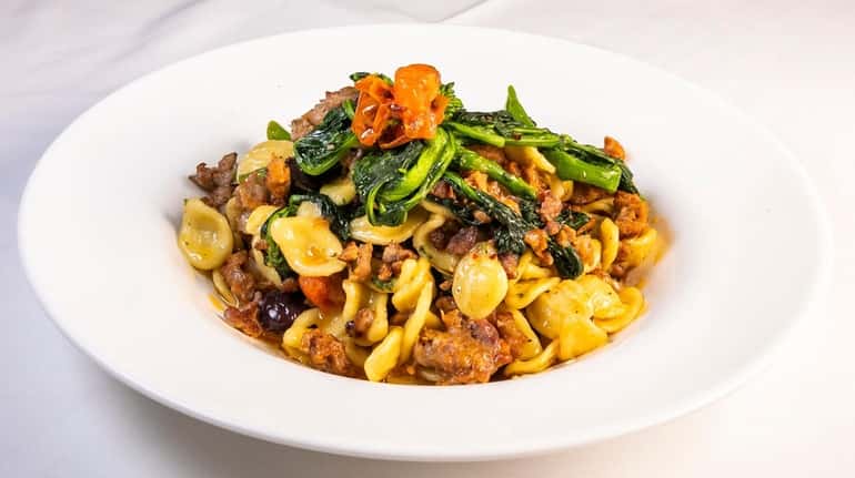 Orecchiette Pugliesi features ear-shaped pasta, sausage and broccoli rabe at Dodici in...