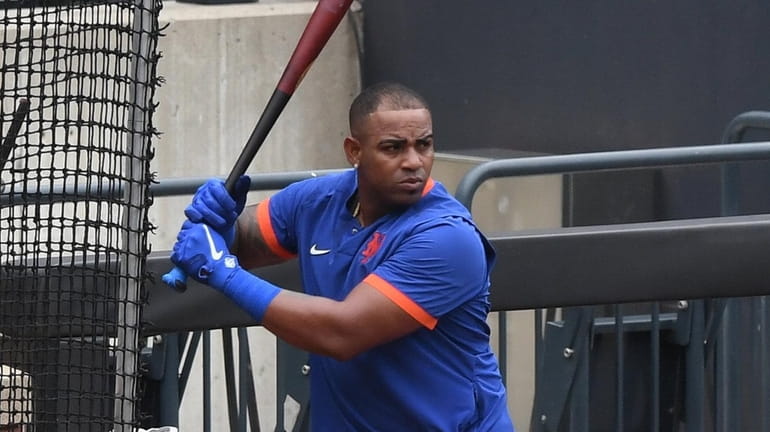 Mets' Yoenis Cespedes looks for his pitch at a bunting...