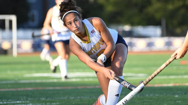 Olivia McKenna (one goal, two assists) passes to a Northport...