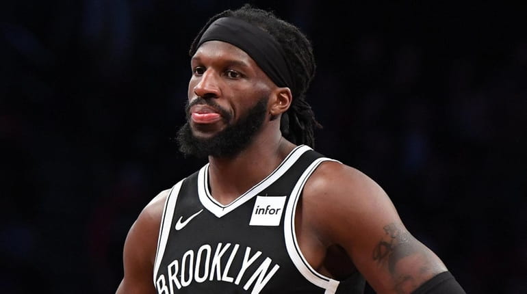 Nets forward DeMarre Carroll looks on during the second half...