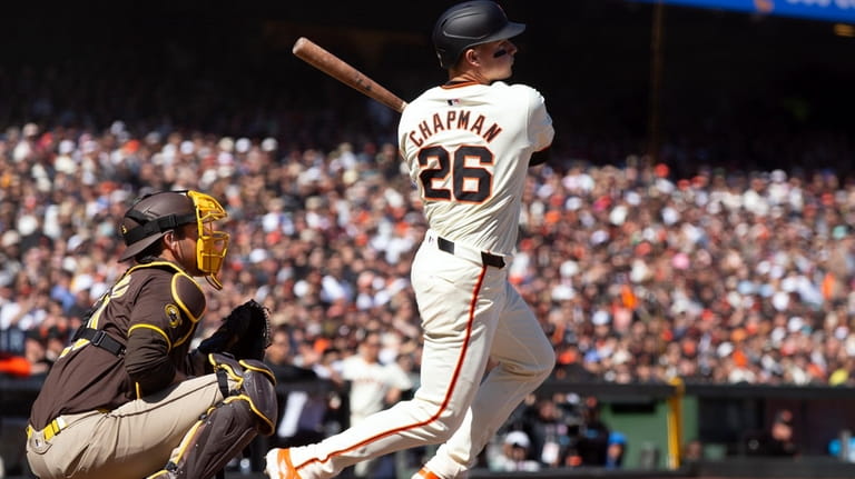 San Francisco Giants third baseman Matt Chapman (26) follows through...