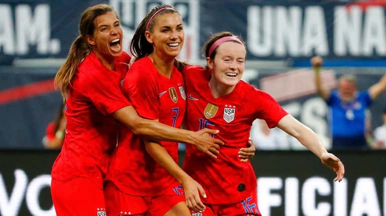 From left, Tobin Heath, Alex Morgan and Rose Lavelle celebrate...