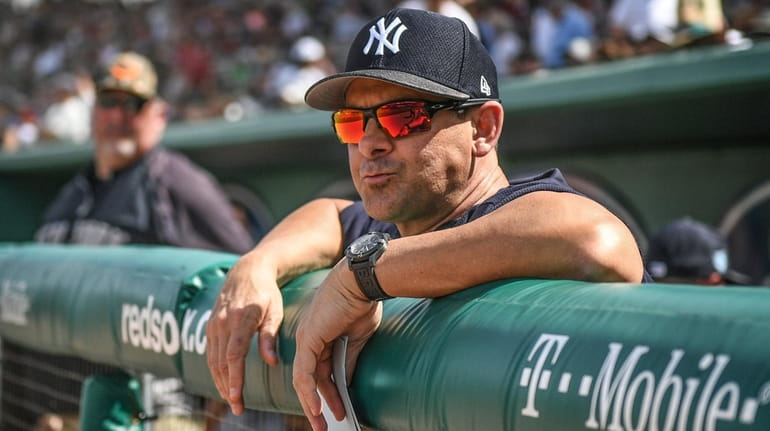 Yankees manager Aaron Boone in the dugout before the start...