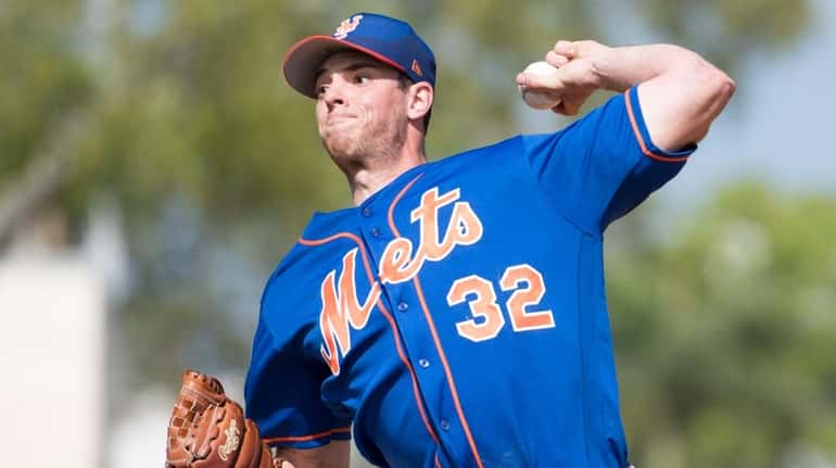 Mets pitcher Steven Matz throws during a spring training workout,...