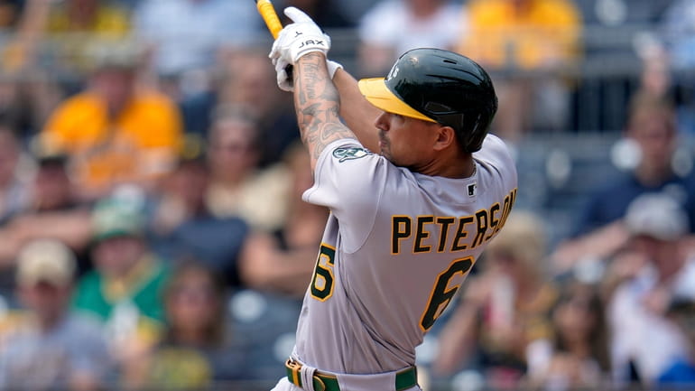 Oakland Athletics' Jace Peterson doubles off Pittsburgh Pirates starting pitcher...