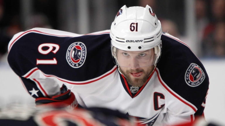 Then-Blue Jackets forward Rick Nash (61) watches a face off...
