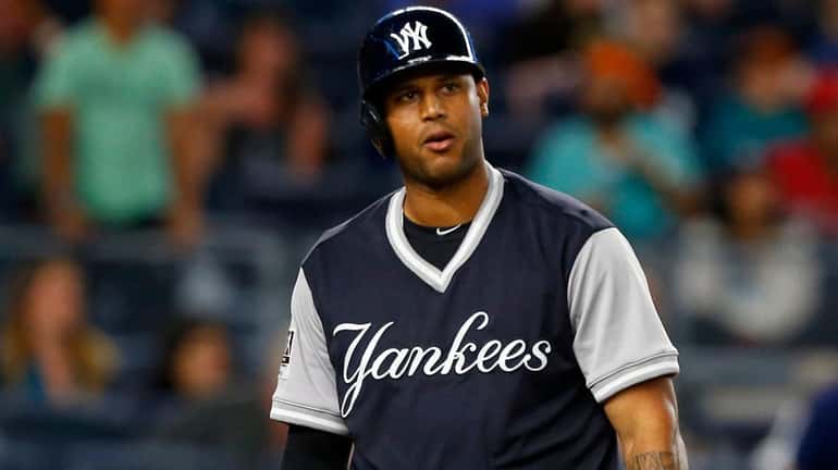 Aaron Hicks of the Yankees strikes out to end a...
