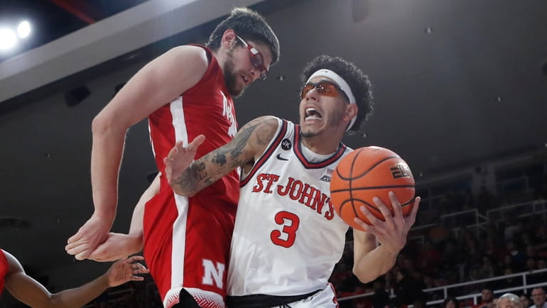 Andre Curbelo #3 of St. John's  drives in the first...