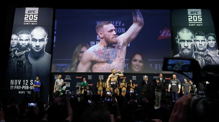 UFC Featherweight Champion Conor McGregor reacts during UFC 205 Weigh-ins...