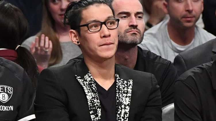 Brooklyn Nets guard Jeremy Lin, center, looks on from the...