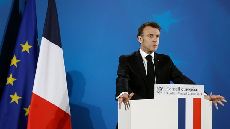 French President Emmanuel Macron addresses a media conference at the...