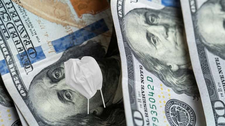 A United States dollar banknote with medical mask. 