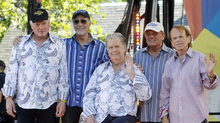 Original members of The Beach Boys, from left, Mike Love,...