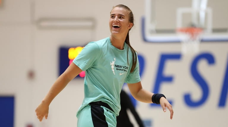 Sabrina Ionescu of the Liberty smiles during practice on July...