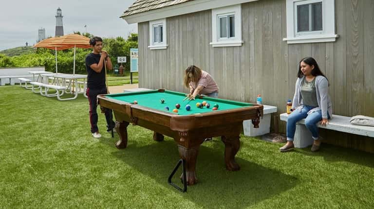 Visitors take advantage of a pool table outside George's Lighthouse...