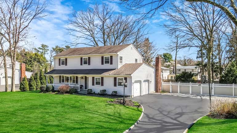 This four-bedroom house in Nesconset, zoned for Smithtown schools, is...