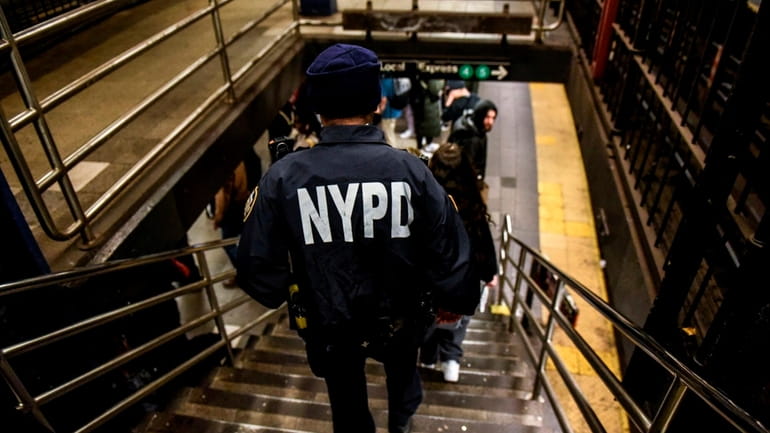 A police officer patrols a subway station in New York...