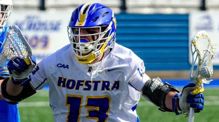 defends Hofstra's Ryan Tierney drives against LIU's Karl LaCalalndra during...