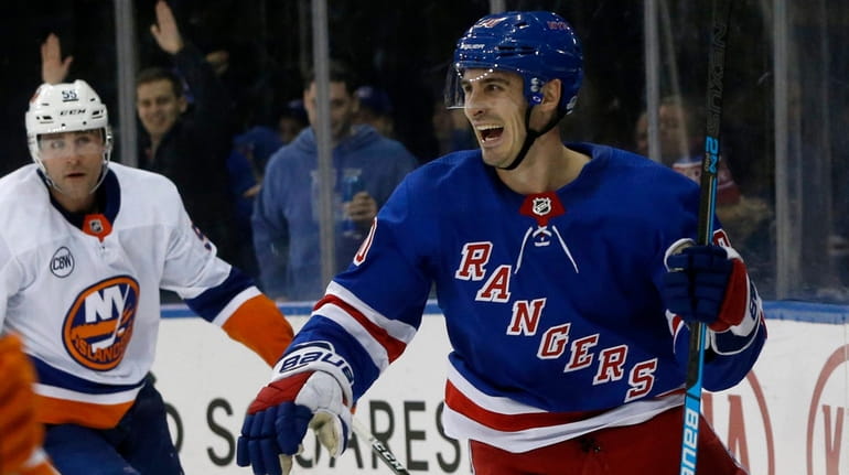 The Rangers' Chris Kreider celebrates his third-period goal against the Islanders...