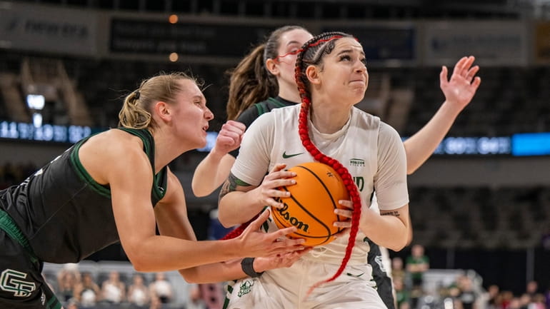 Green Bay guard Callie Genke, left, attempts to steal the...