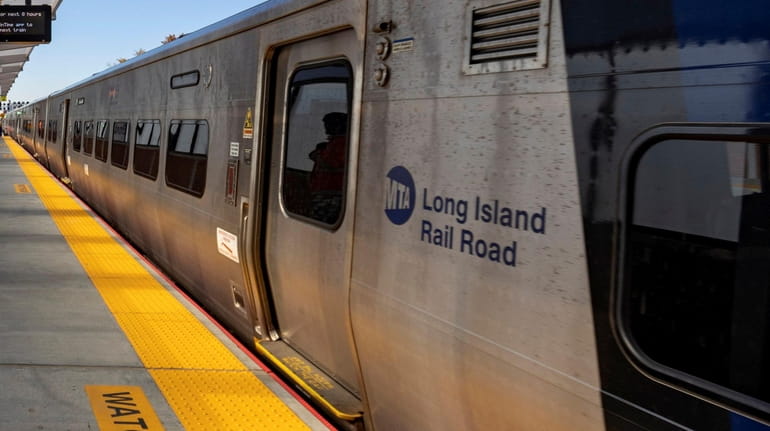 The first LIRR train arrives at the new Elmont LIRR...