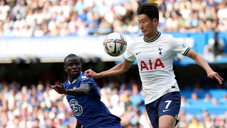 Tottenham's Son Heung-min, right, duels for the ball with Chelsea's...
