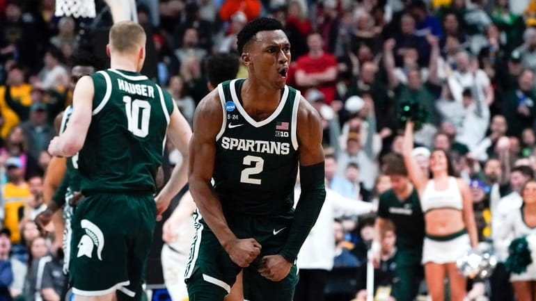Michigan State guard Tyson Walker (2) reacts after a basket...