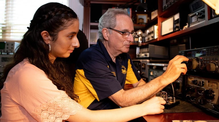 Howard Bernstein teaches morse code to his daughter Alana at...