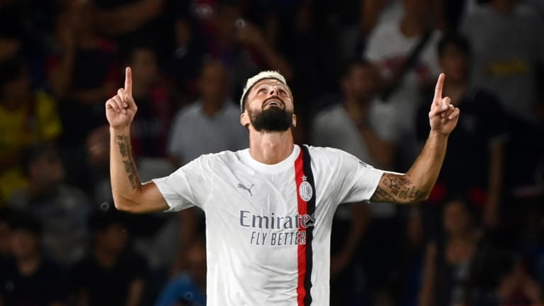 AC Milan's Olivier Giroud celebrates scoring during the Serie A...